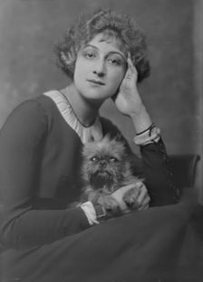 Melville, Mrs., with dog, portrait photograph, not before 1916. Creator: Arnold Genthe