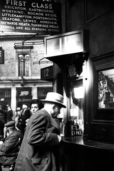 Member of Locomotive Spotters at Victoria Station, 1950. Creator: Henry Grant