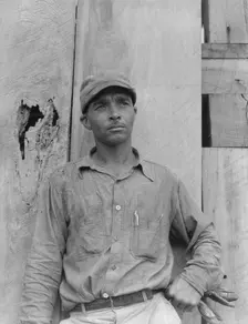 Member of the Delta cooperative farm, Hillhouse, Mississippi, 1937. Creator: Dorothea Lange