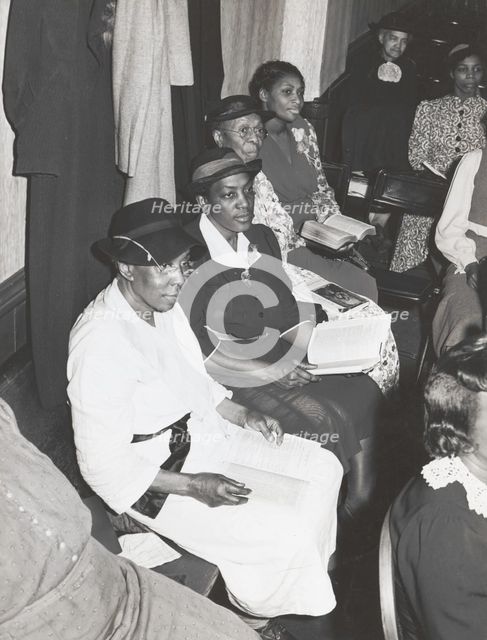 Members of the congregation of the "store front" Baptist Church, Chicago, Illinois, April, 1941. Creators: Farm Security Administration, Russell Lee.