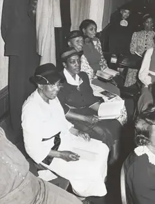 Members of the congregation of the "store front" Baptist Church, Chicago, Illinois, April, 1941. Creators: Farm Security Administration, Russell Lee