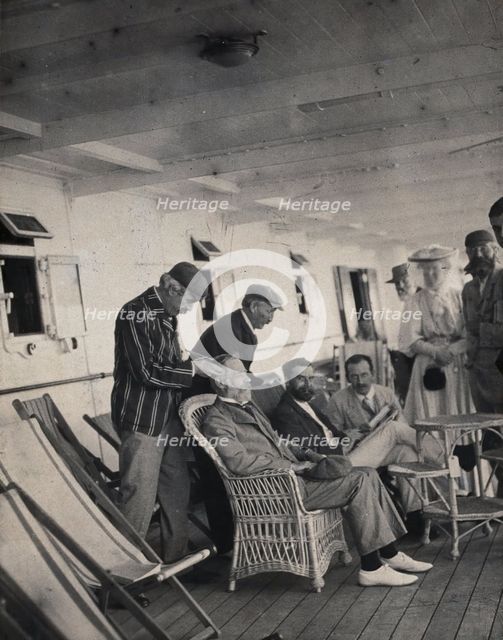 Members of the British Association playing at phrenology on board a ship on its way to..., 1905. Creator: James Thomson Bottomley.