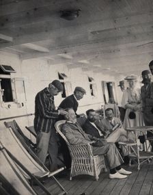 Members of the British Association playing at phrenology on board a ship on its way to..., 1905. Creator: James Thomson Bottomley