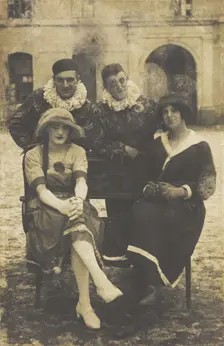 Members of The Stars concert party, two soldiers in drag and two as pierrots, pose around..., 1919 Creator: Unknown