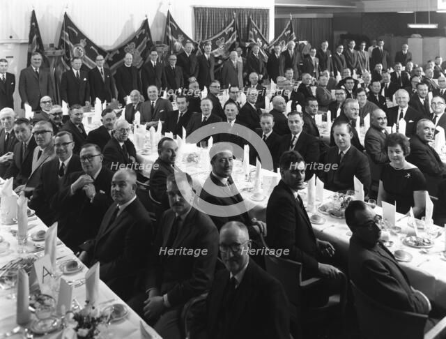Members of the Royal Army Ordnance Corps (RAOC) gather for their annual dinner, 1965. Artist: Michael Walters