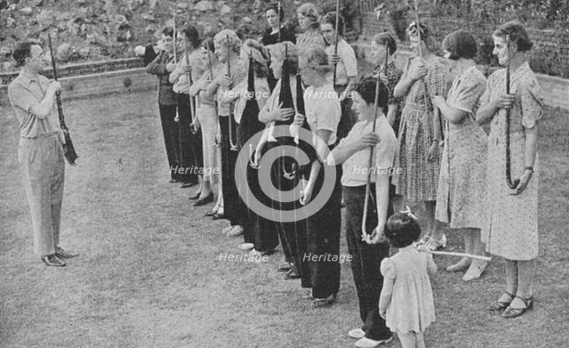 Members of the Women's Volunteer Defence Corps being trained in rifle drill, World War II, 1940. Artist: Unknown
