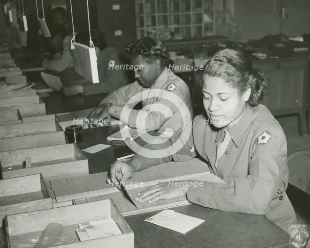 Members of the Women's Army Corps identifying incorrectly addressed mail for soldiers..., 1943. Creator: Unknown.