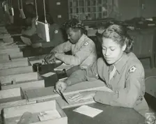 Members of the Women's Army Corps identifying incorrectly addressed mail for soldiers..., 1943. Creator: Unknown