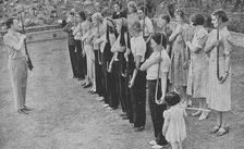 Members of the Women's Volunteer Defence Corps being trained in rifle drill, World War II, 1940