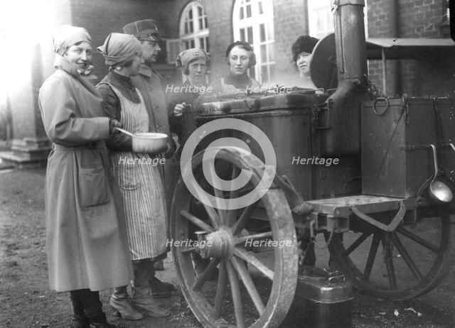 Members of the Womens's Army Auxiliary Corps cooking at a field kitchen, Sweden, 1933. Artist: Unknown