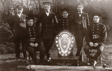 Members of the winning Rowntree Ambulance Team pose with trophy, York, Yorkshire, 24 Jan 1914