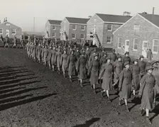 Members of an all-African American company walking in rows during an infantry drill..., 1943. Creator: Unknown