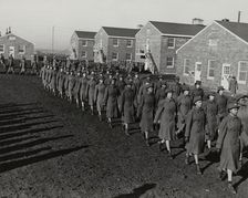 Members of an all-African American company walking in rows during an infantry drill..., 1943. Creator: Unknown