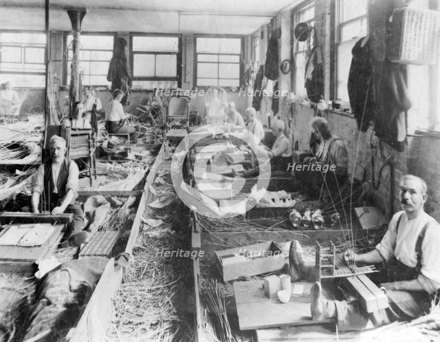 Men making wicker baskets for Scotts & Sons, London.  Creator: Unknown.