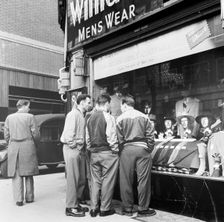 Men outside a menswear shop, London, late 1950s. Creator: Henry Grant