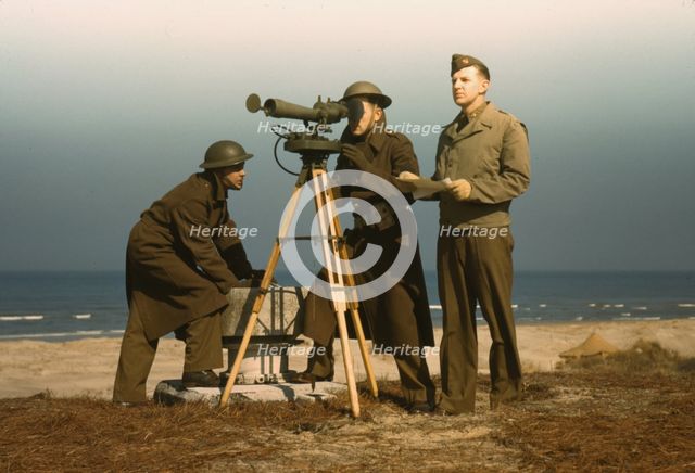 Men of Fort Story operate an azimuth instrument, to measure the angle..., Fort Story, Va., 1942. Creator: Alfred T Palmer.