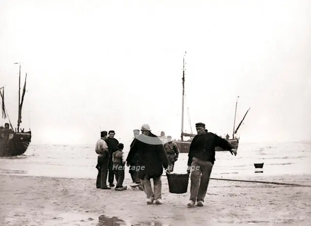 Men on the shore, Scheveningen, Netherlands, 1898.Artist: James Batkin