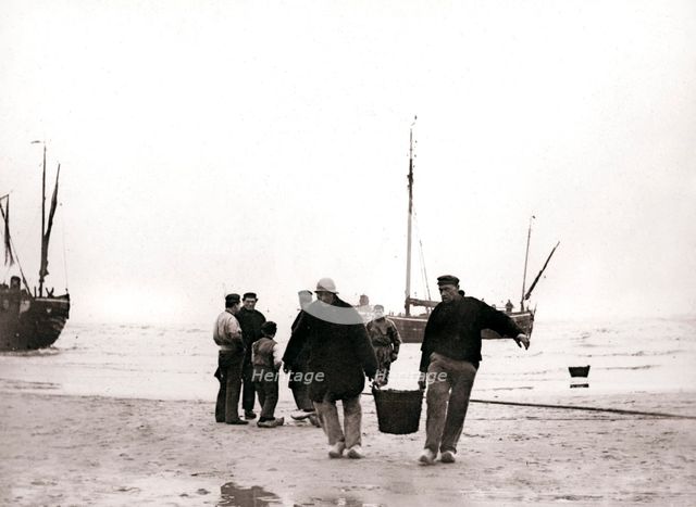 Men on the shore, Scheveningen, Netherlands, 1898.Artist: James Batkin