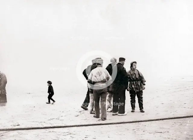 Men on the shore, Scheveningen, Netherlands, 1898.Artist: James Batkin
