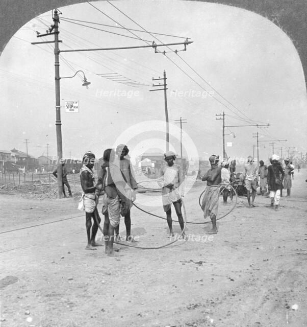 Men about to draw a heavy load, Rangoon, Burma, 1908. Artist: Stereo Travel Co