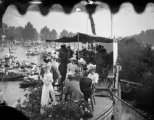 Men and women take tea on a college barge overlooking the Henley Royal Regatta, Oxfordshire, 1897. Creator: Henry Taunt
