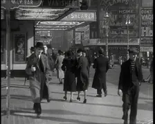 Men and Women Walking Through Leicester Square With the Leicester Corner Restaurant..., 1939. Creator: British Pathe Ltd