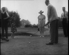 Men and Women at the Golf Links With One Man Lining up His Shot, 1939. Creator: British Pathe Ltd