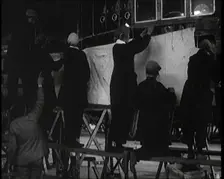 Men and Women Building the Body of the Cockpit of an R 38 Airship in a Hangar, 1921. Creator: British Pathe Ltd