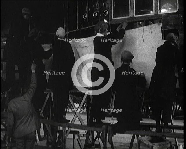 Men and Women Building the Body of the Cockpit of an R 38 Airship in a Hangar, 1921. Creator: British Pathe Ltd.