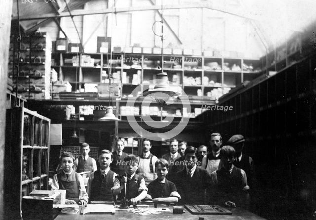 Men and boys in a printing workshop, (late 19th-early 20th century?). Creator: Unknown.