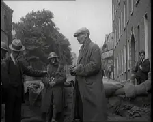 Men Being Stopped and Searched at a Roadblock in Ireland, United Kingdom, 1920. Creator: British Pathe Ltd