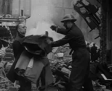 Men Clearing Out Possessions from a Bombed Out Building, 1940. Creator: British Pathe Ltd
