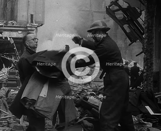Men Clearing Out Possessions from a Bombed Out Building, 1940. Creator: British Pathe Ltd.