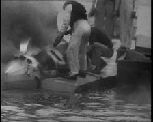 Men Extinguishing a Fire , 1933. Creator: British Pathe Ltd