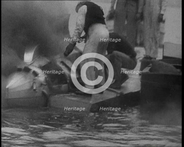 Men Extinguishing a Fire , 1933. Creator: British Pathe Ltd.