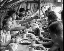 Men Eating Under a Canopy, 1933. Creator: British Pathe Ltd