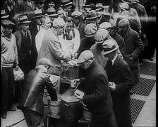 Men Getting Soup from a Soup Kitchen, 1933. Creator: British Pathe Ltd