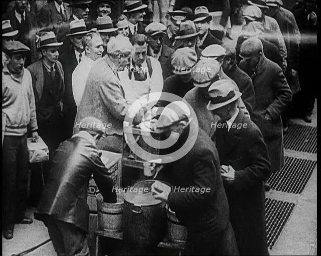 Men Getting Soup from a Soup Kitchen, 1933. Creator: British Pathe Ltd.