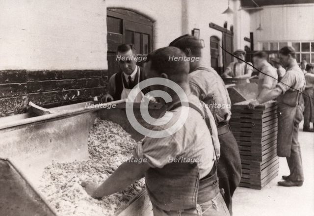 Men hand sugaring fruit pastilles, Rowntree factory, York, Yorkshire, 1920. Artist: Unknown