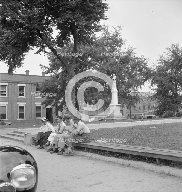 Men idling around the courthouse square, Roxboro, North Carolina, 1939. Creator: Dorothea Lange.