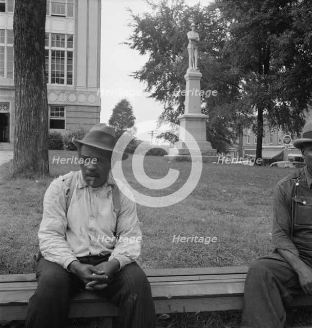 Men idling around the courthouse square, Roxboro, North Carolina, 1939. Creator: Dorothea Lange.