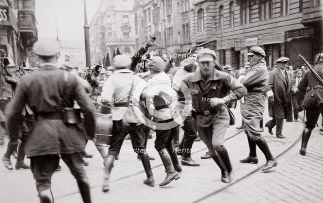 Men in Bolshevik uniform fighting police in the street, Germany, c1918-c1933(?) (1936). Creator: Unknown.