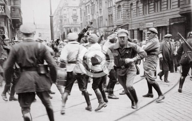 Men in Bolshevik uniform fighting police in the street, Germany, c1918-c1933(?) (1936). Artist: Unknown