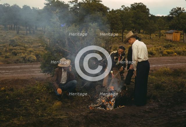 Men in front of outdoor fire, Pie Town Fair, New Mexico, 1940. Creator: Russell Lee.