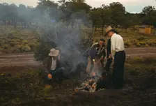 Men in front of outdoor fire, Pie Town Fair, New Mexico, 1940. Creator: Russell Lee