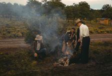 Men in front of outdoor fire, Pie Town Fair, New Mexico, 1940. Creator: Russell Lee