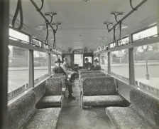 Men in hats and coats in the interior of an electric tram, London, 1933