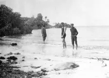 Men in swimming costumes at the water's edge, possibly at the mouth of the Tweed River, 1910. Creator: Robert Augustus Henry L'Estrange