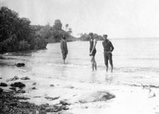 Men in swimming costumes at the water's edge, possibly at the mouth of the Tweed River, 1910. Creator: Robert Augustus Henry L'Estrange