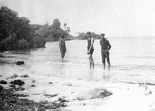 Men in swimming costumes at the water's edge, possibly at the mouth of the Tweed River, 1910. Creator: Robert Augustus Henry L'Estrange